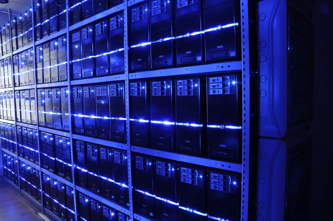 Server room representing the compute infrastructure that long-horizon allocation monitoring depends on, with rows of racks.